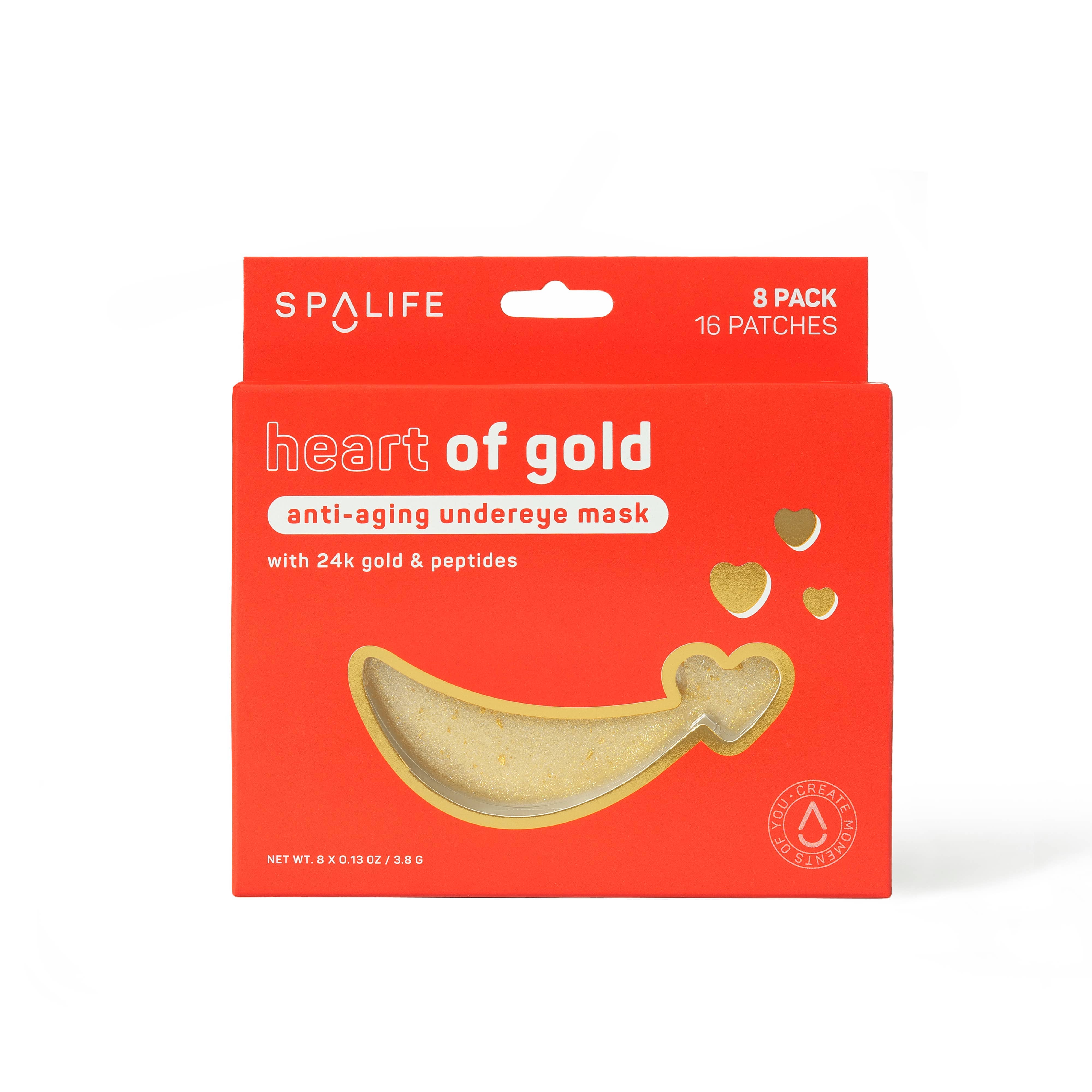 Red packaging for "heart of gold" under eye mask by SpaLife. Features a crescent-shaped mask with gold accents and floating heart designs.