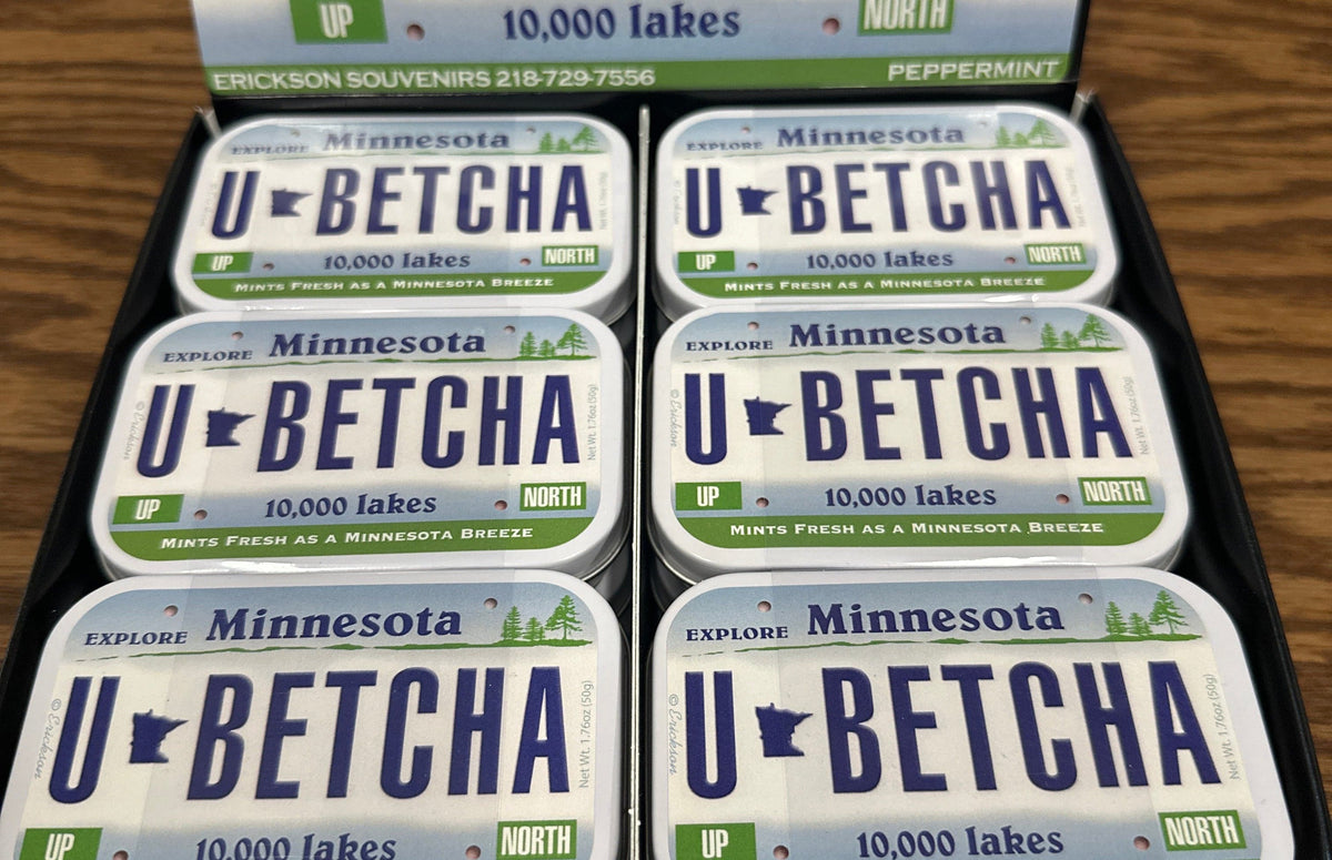 Display of 'U-Betcha' mints with Minnesota-themed packaging on a wooden surface.