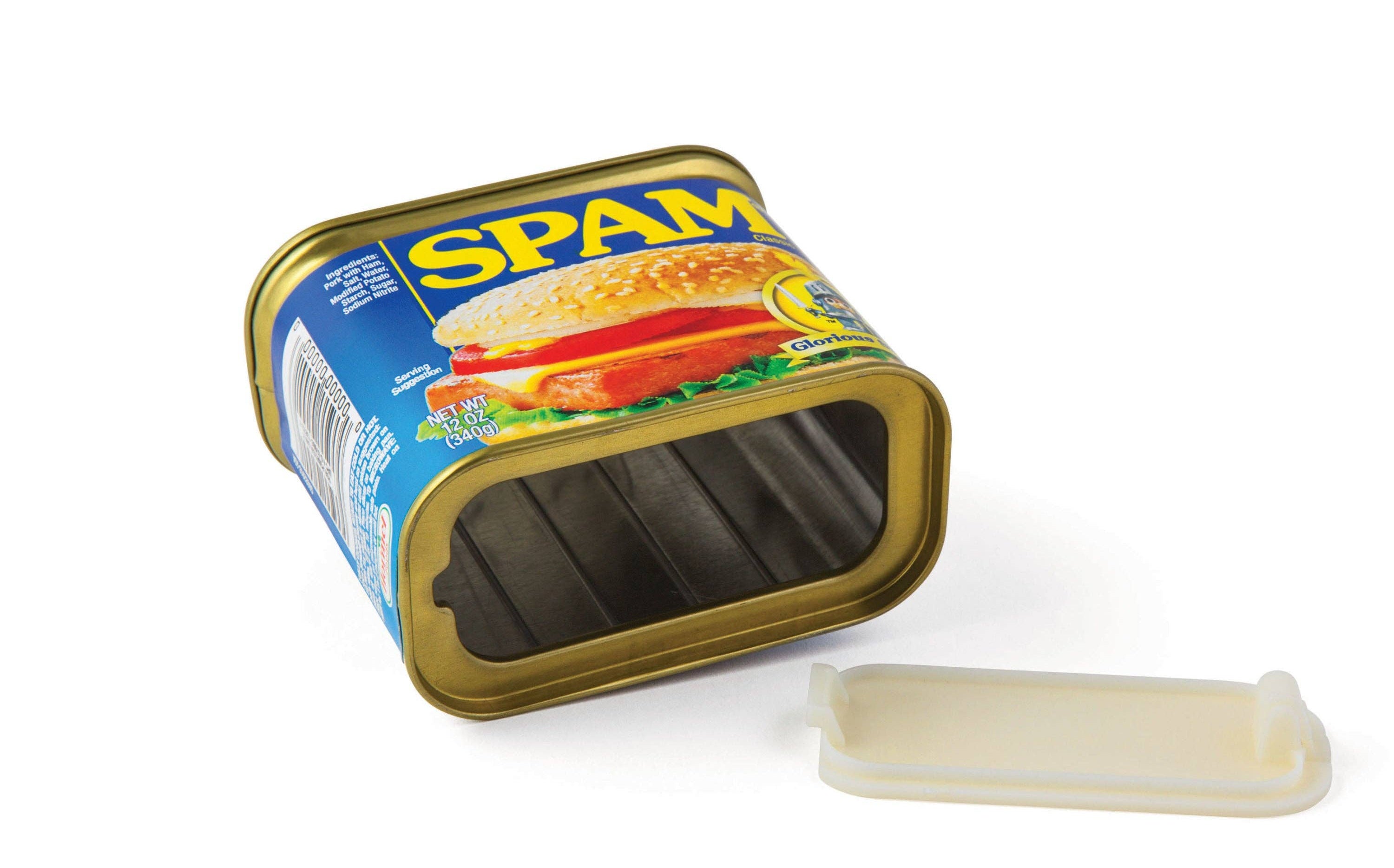 Empty rectangular can of Spam with lid removed, lying on its side. Blue and yellow label featuring a sandwich image, evoking a playful tone.