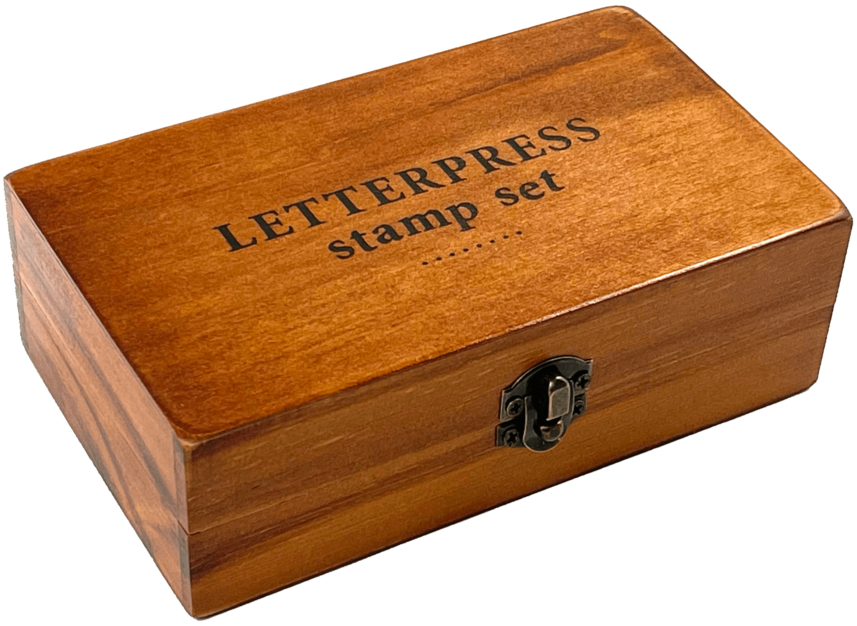 A wooden box labeled "LETTERPRESS stamp set" with a metal latch, resting on a transparent background. The box has a warm, polished finish.