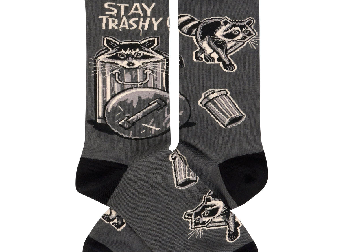 Black socks with raccoon illustrations and 'Stay Trashy' text on a white background