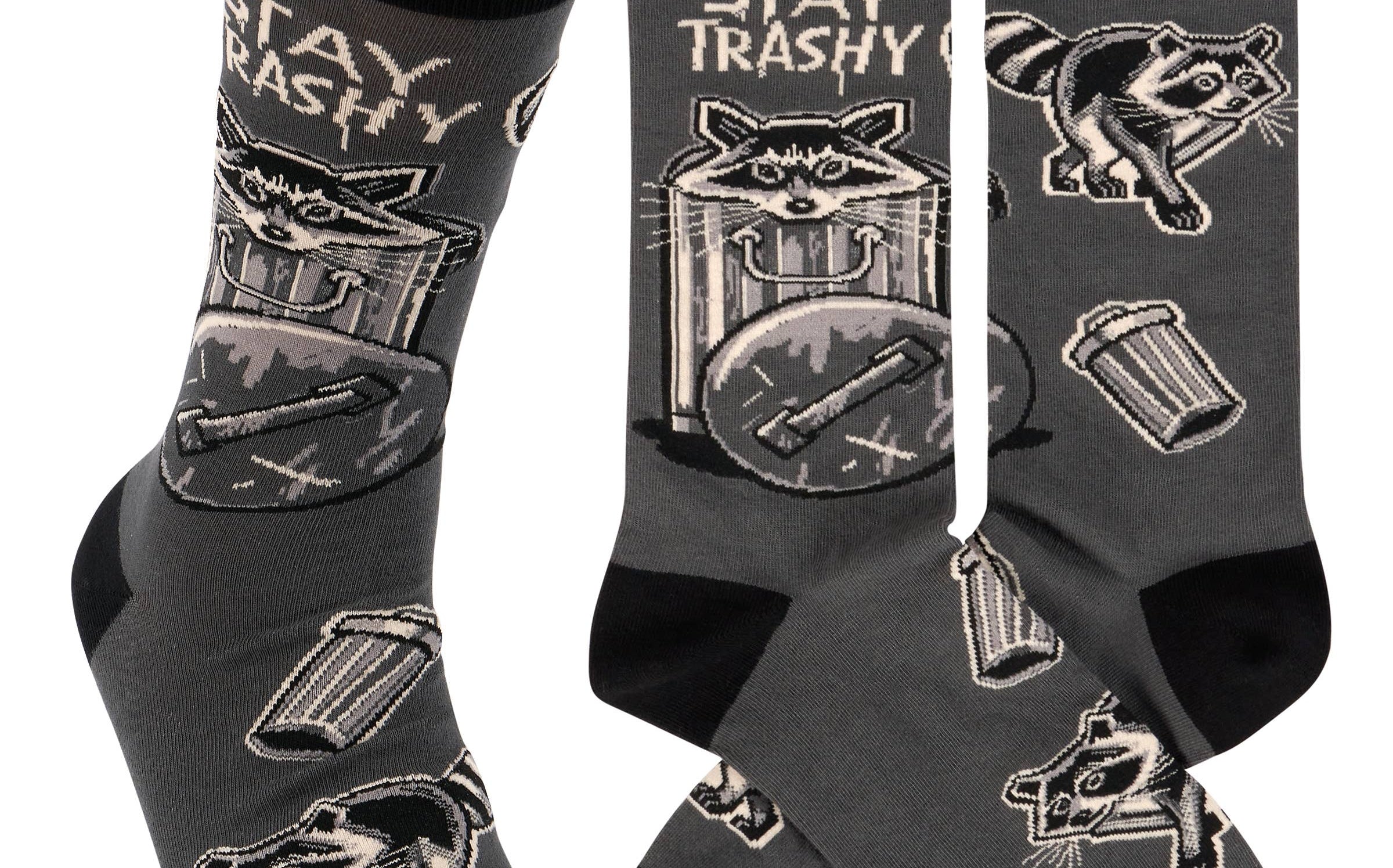 Gray socks with raccoon and trash can designs and 'Stay Trashy' text on a white background