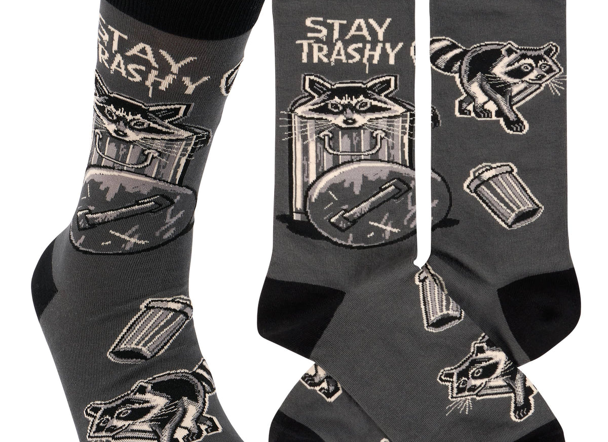 Gray socks with raccoon and trash can designs and 'Stay Trashy' text on a white background