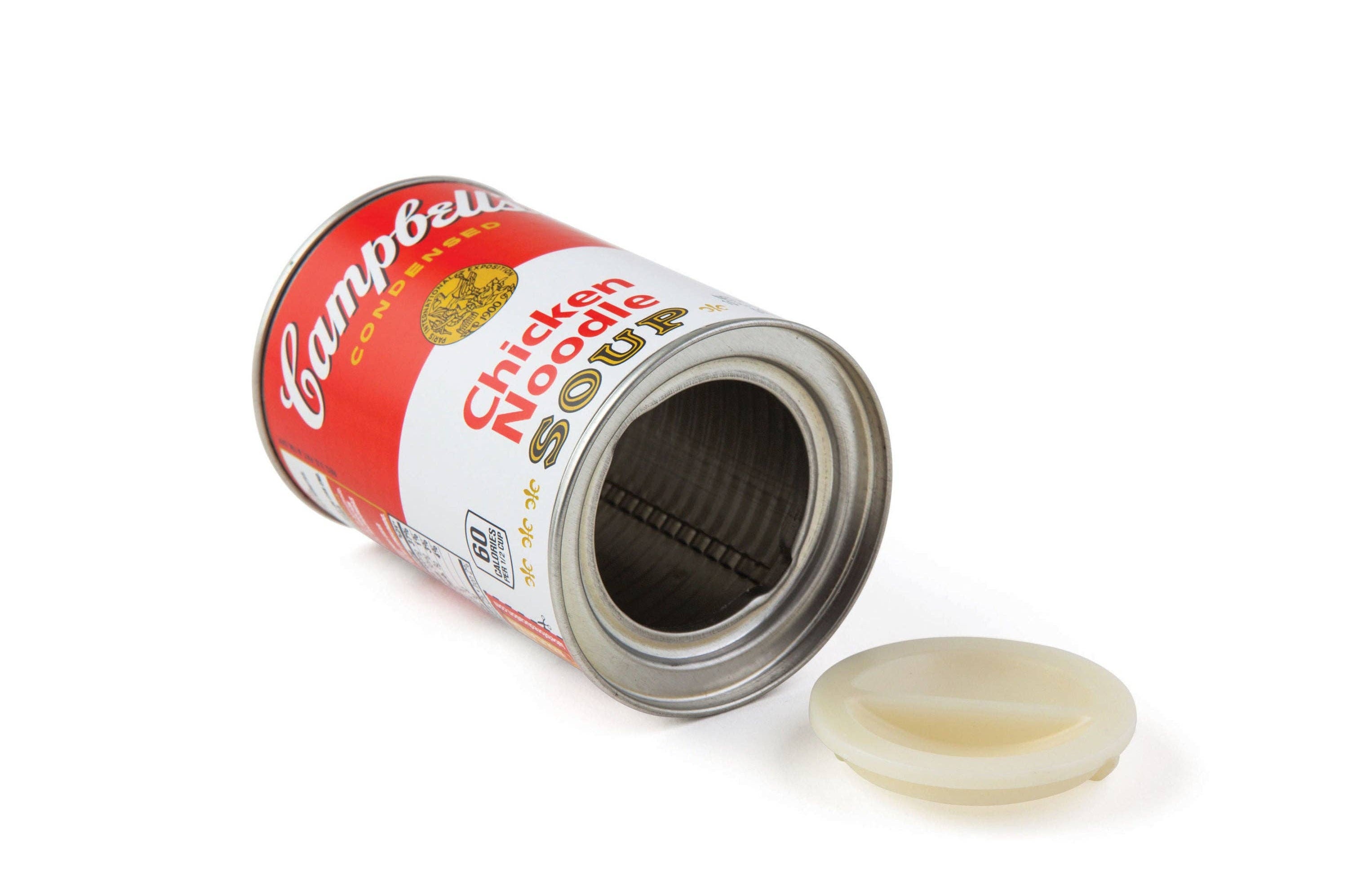 Open Campbell’s chicken noodle soup can with a detached lid on a white background. The can is laid on its side, conveying an iconic pop-art feel.