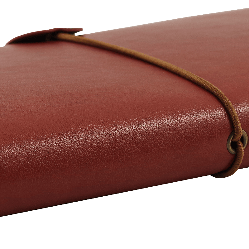 A closed brown leather journal with a wrap-around cord, laying on a transparent background; evokes a sense of adventure and nostalgia.