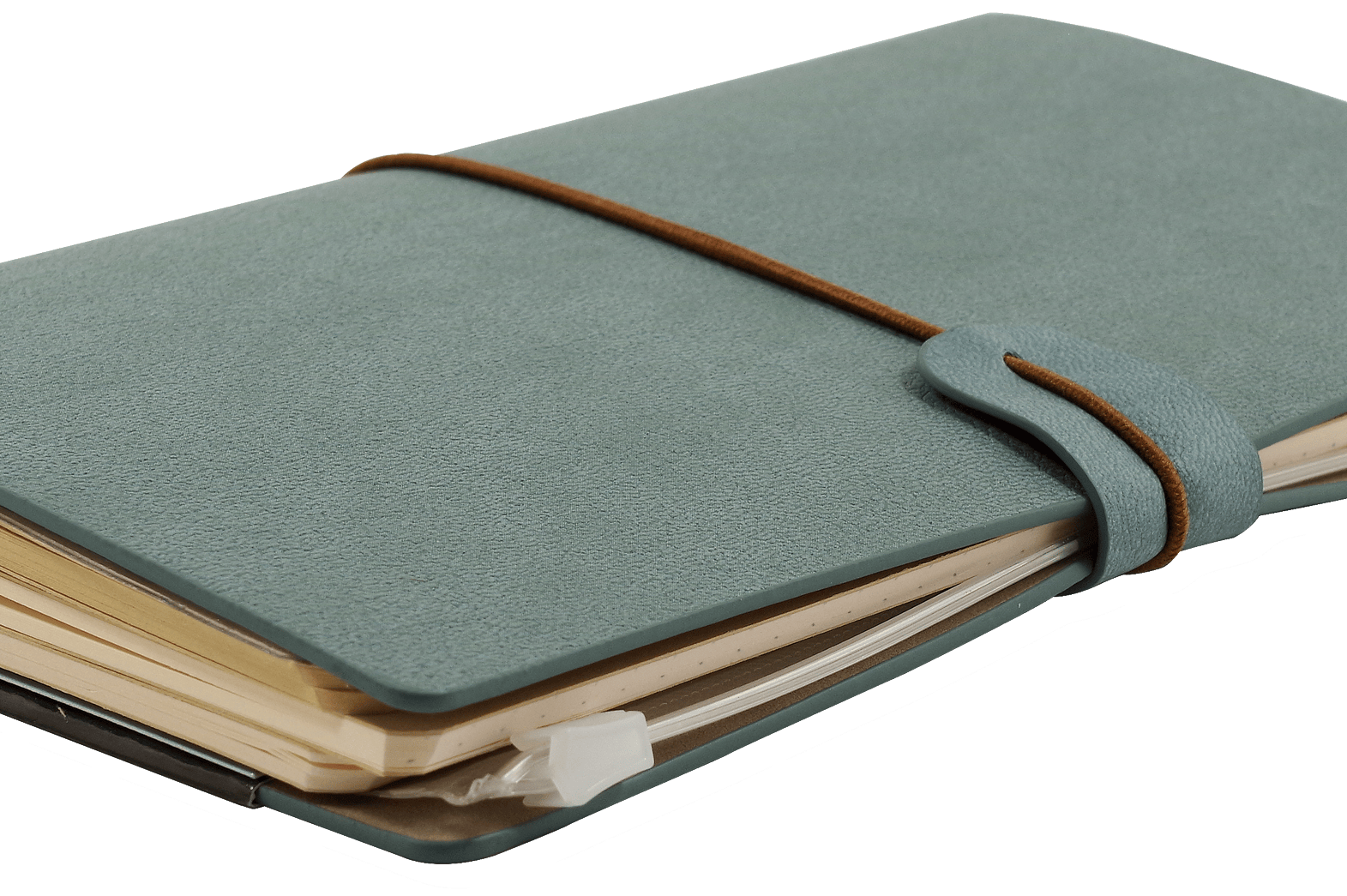 A closed gray-blue leather journal with a brown elastic strap, filled with slightly worn pages, rests on a transparent background. It conveys a vintage, well-used feel.