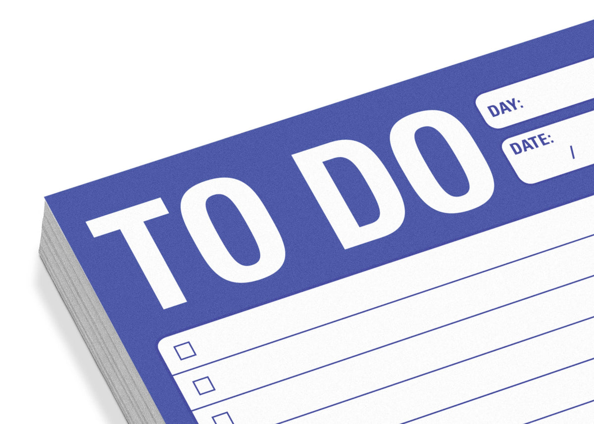 Stacked to-do list sheets with a blue border and bold "TO DO" title at the top. Lines and checkboxes are below, with spaces for day and date, conveying organization.