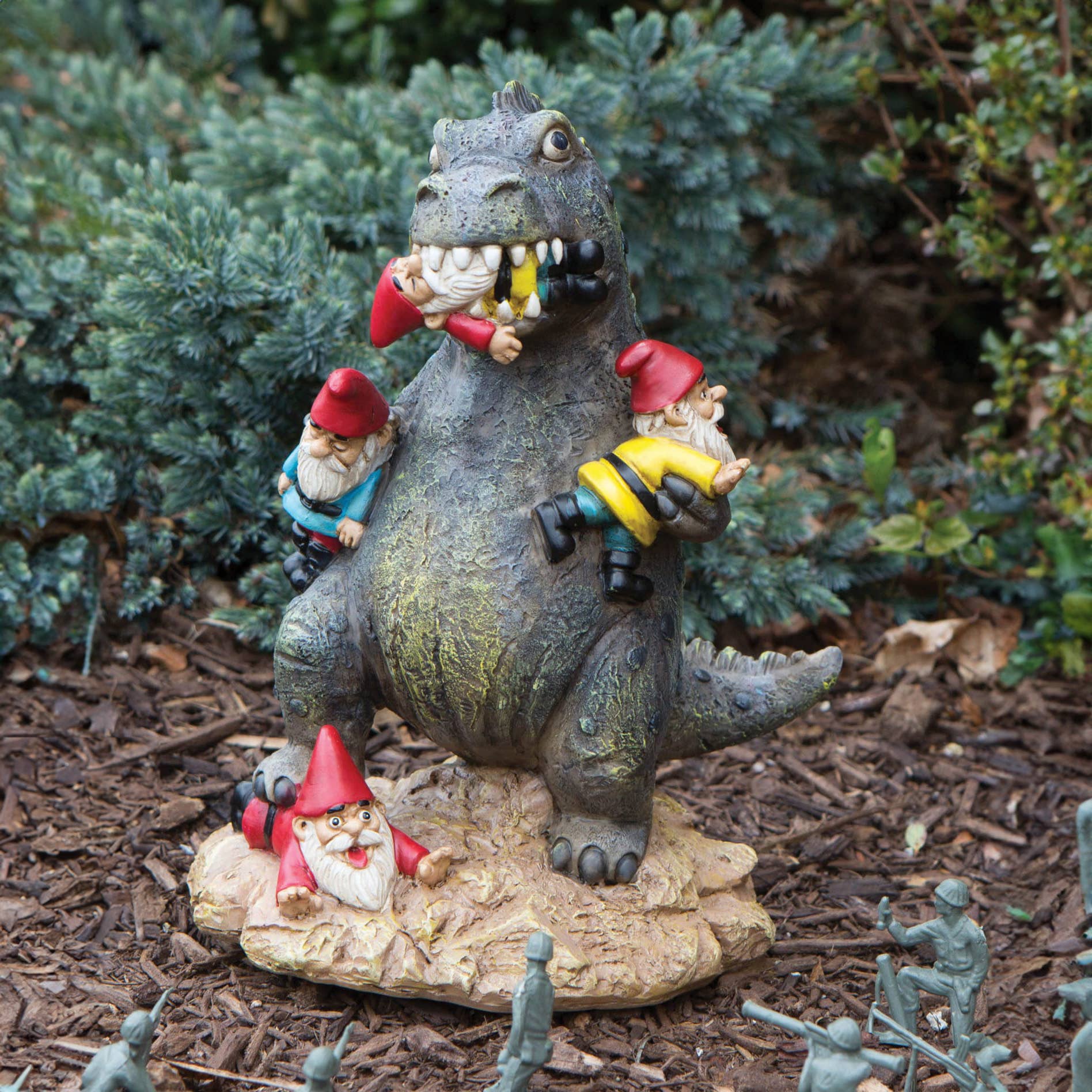 A whimsical scene with a dinosaur figurine in a garden, surrounded by small gnome statues. Some gnomes are climbing on its back, while one is being playfully chomped. The setting is lighthearted and humorous.
