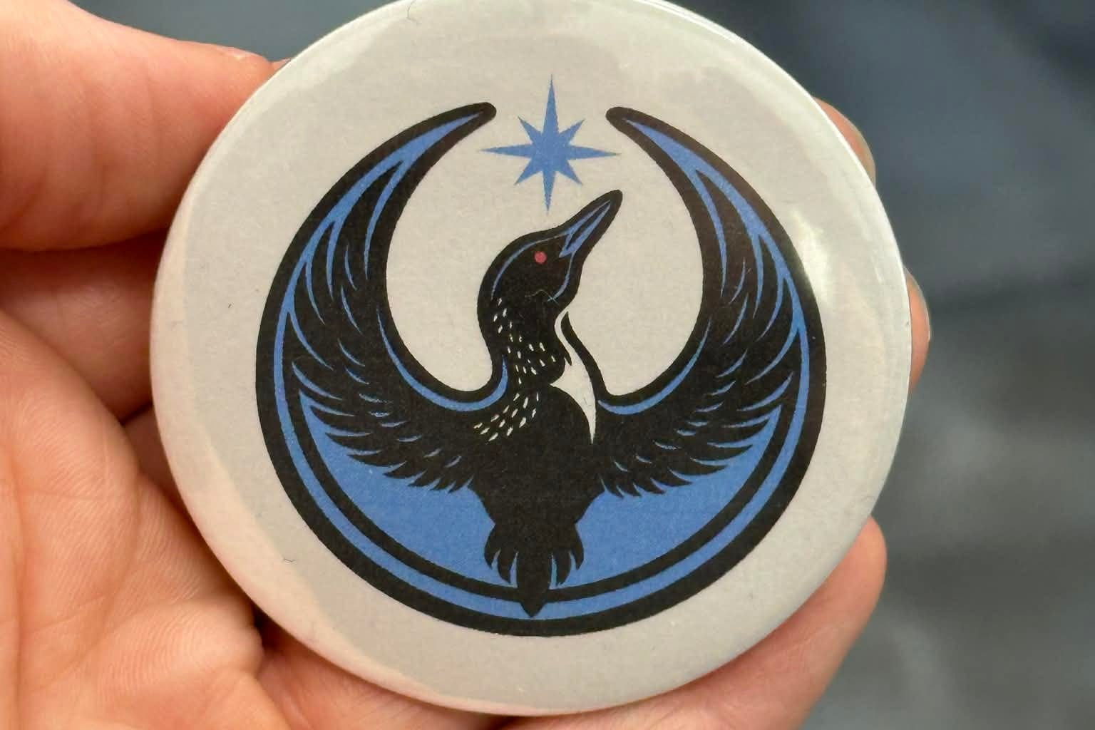 Rebel Loon Design on a white Button