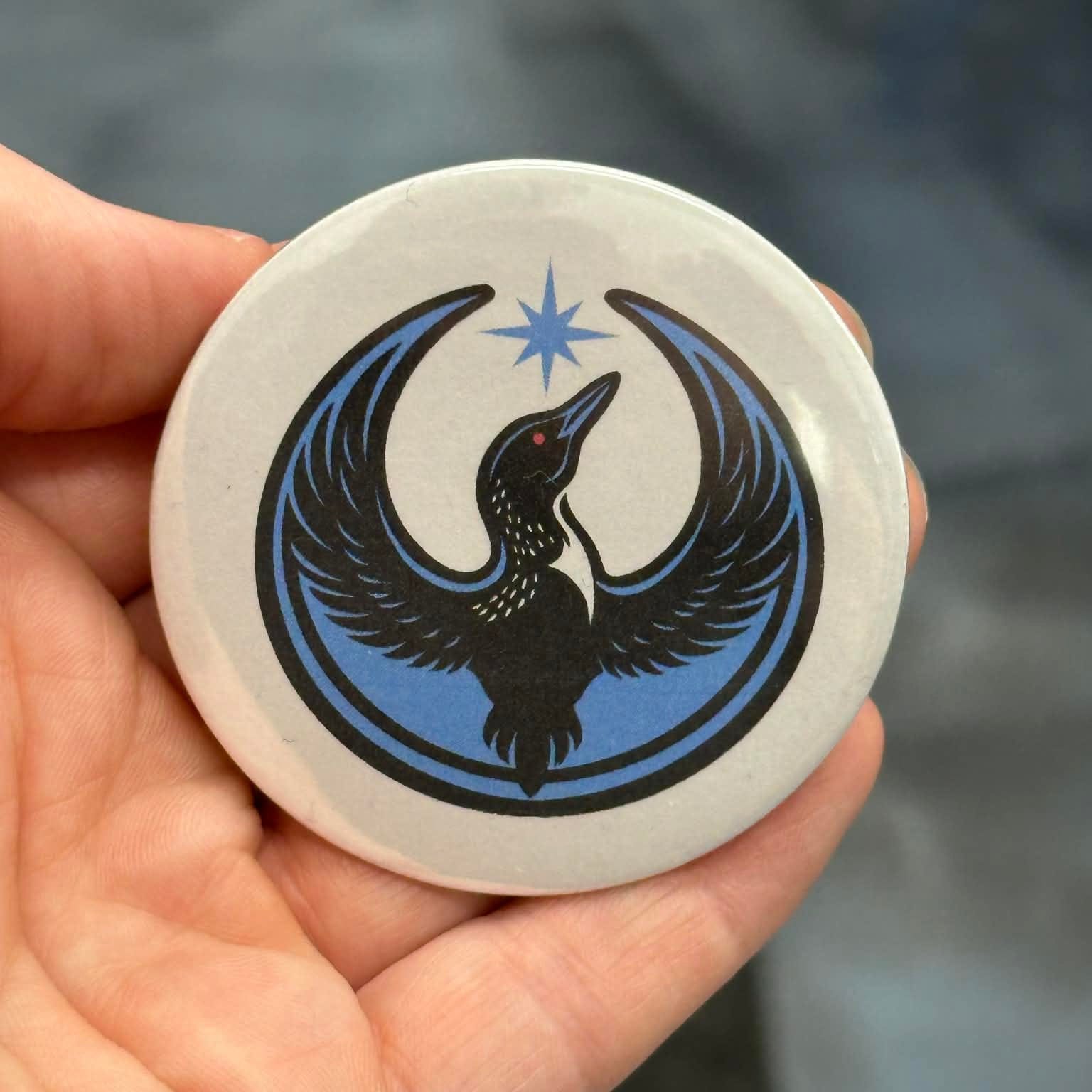 Rebel Loon Design on a white Button