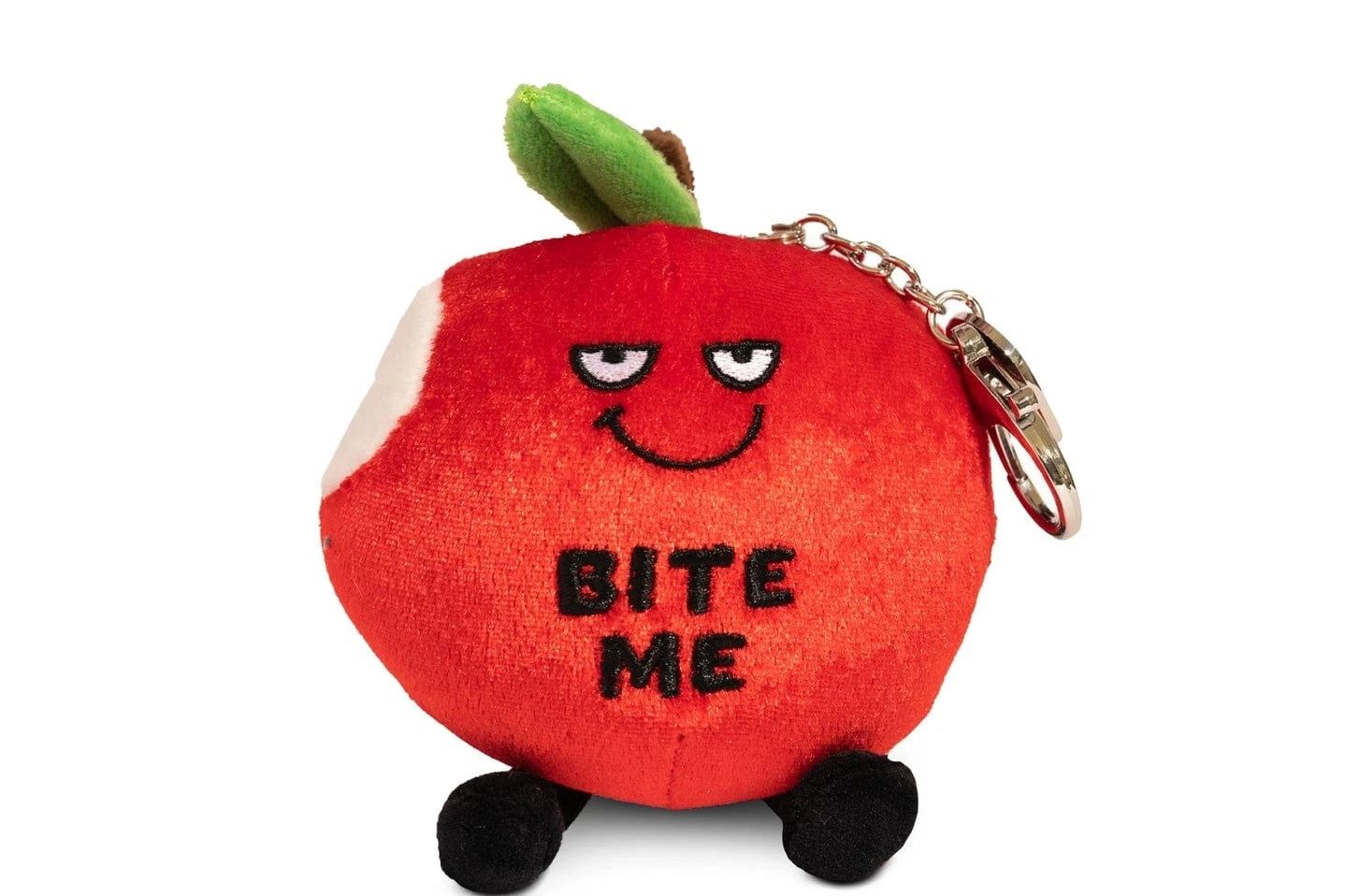 A plush bag charm shaped like a red apple with a playful, mischievous expression. One side features a bite mark, adding to its cheeky design. The plush has small black dangling legs and a green leaf on top. Embroidered on the front are the words 'BITE ME' in bold, black letters. Attached to the plush is a silver keychain clip, making it a fun and sassy accessory for bags or backpacks.