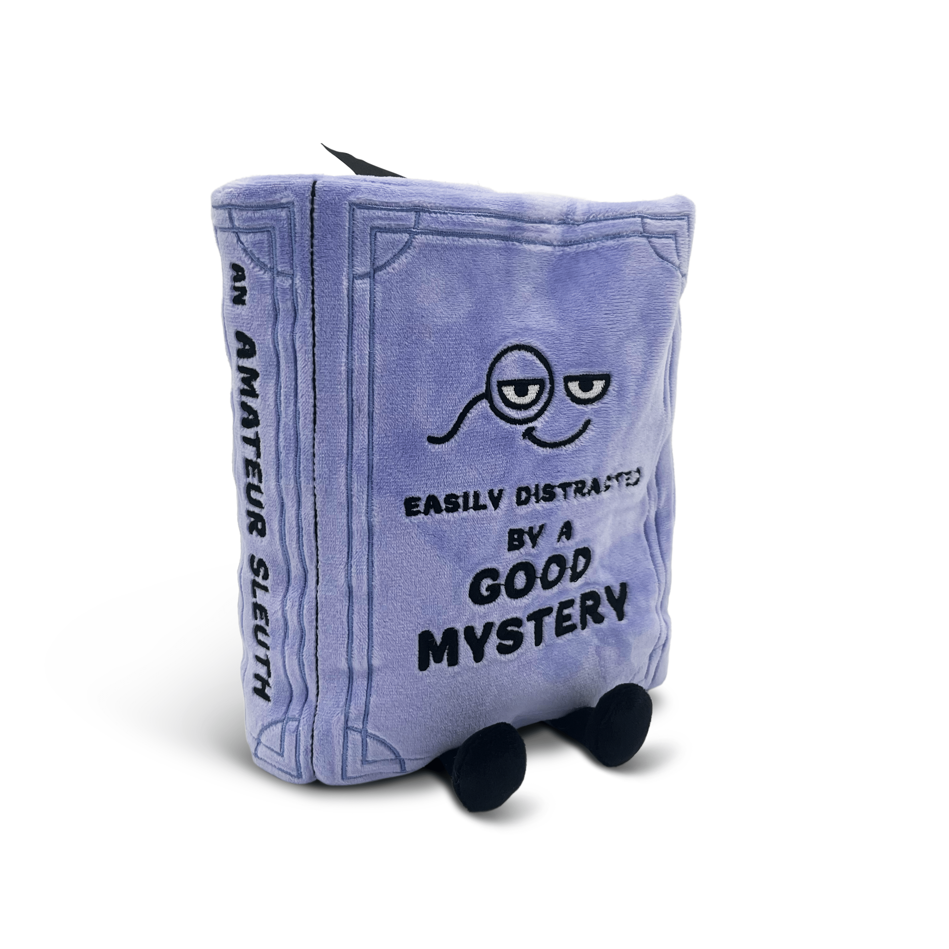 Plush toy shaped like a book with a character design and text on a white background