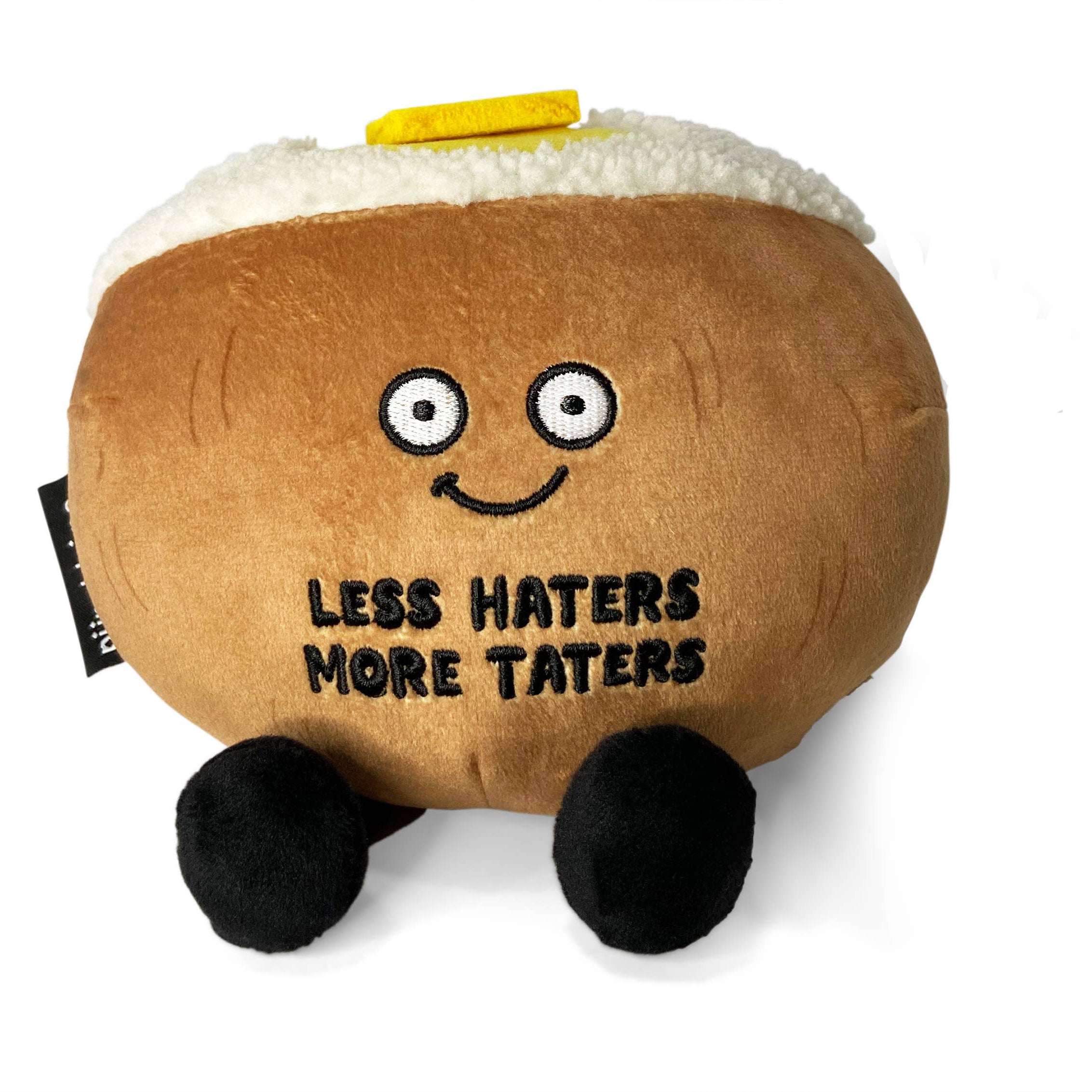Brown baked potato plush with black legs, a white top, and a pat of yellow butter on top.