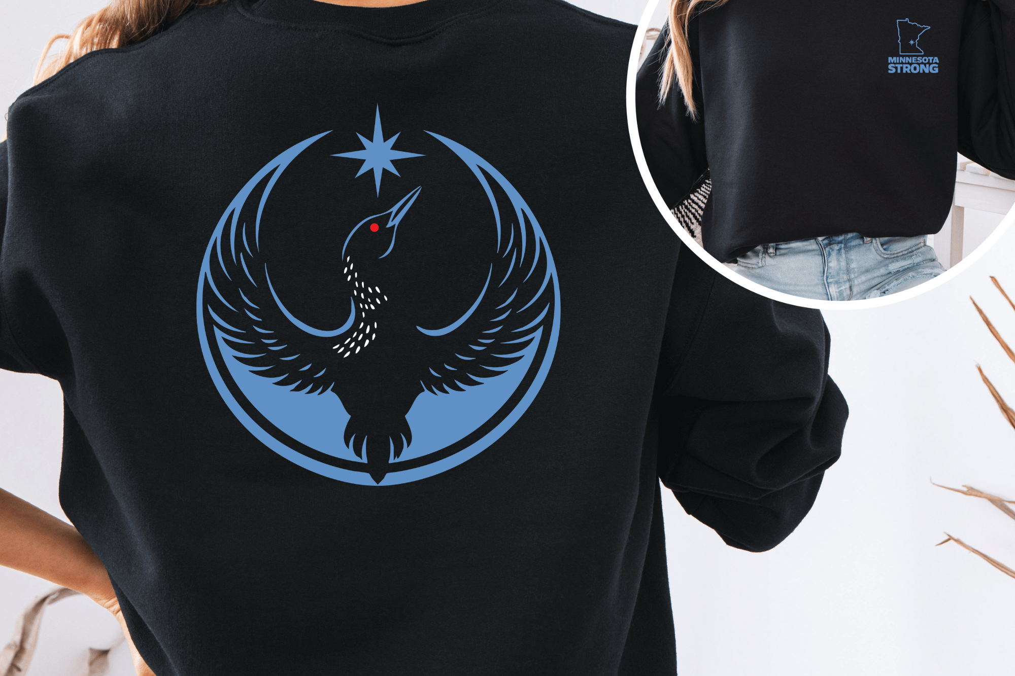 Black Crew Neck Sweatshirt with the Rebel Loon Design on the back and a front pocket logo design of the Minnesota State Outline and the words "Minnesota Strong"