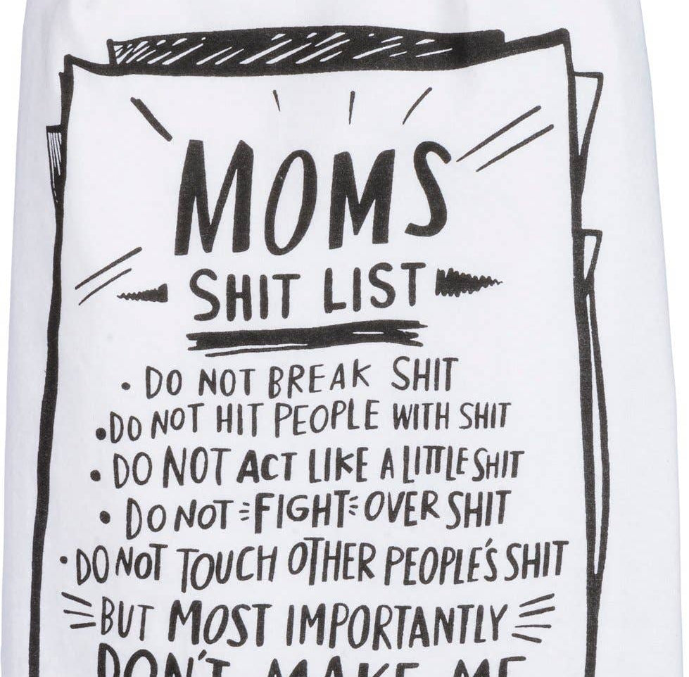 A white dish towel displays a humorous list titled "Mom's Shit List" with bold, playful typography. The tone is comedic and light-hearted.