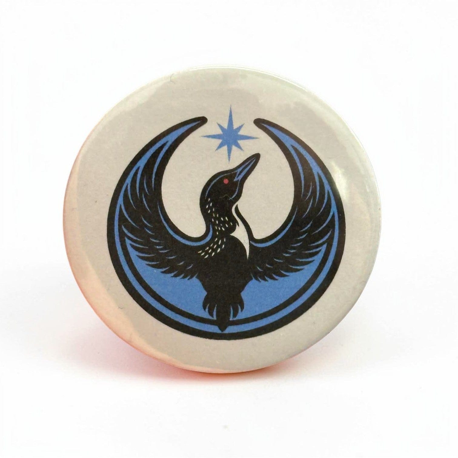 Rebel Loon printed on a white background on a button.