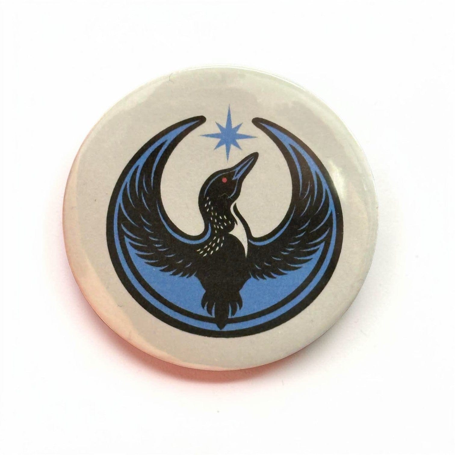 Rebel Loon printed on a white background on a button.