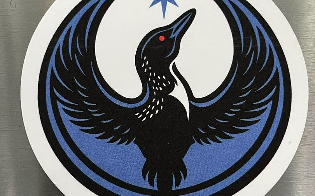 Rebel Loon Circle Magnet on a stainless steel refigerator