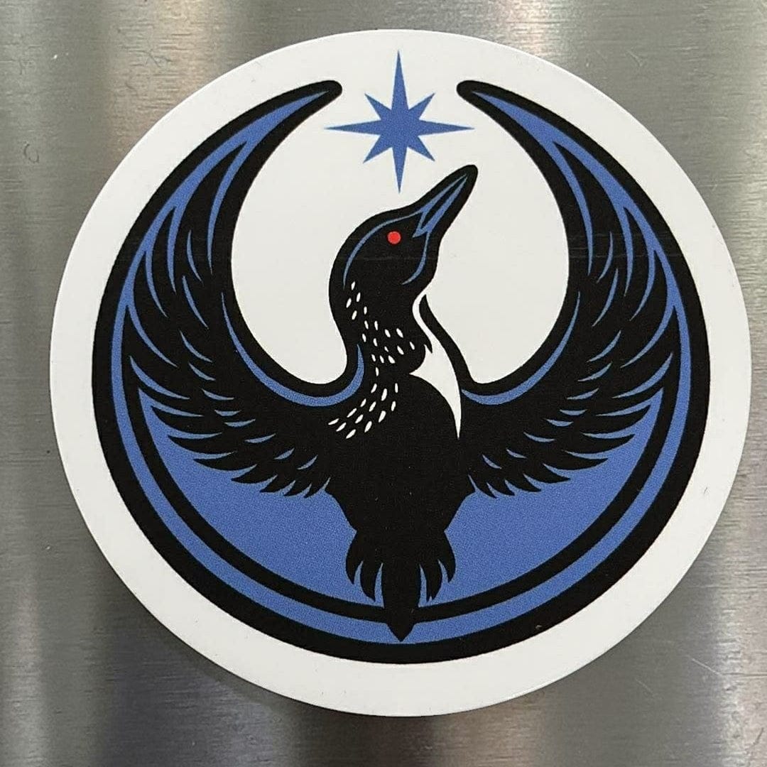 Rebel Loon Circle Magnet on a stainless steel refigerator