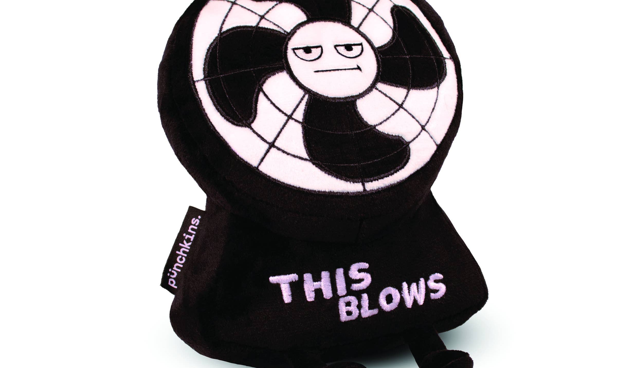 A plush toy designed to look like an annoyed electric fan with a black and white color scheme. The face of the fan has a grumpy expression, and the toy's base features the phrase 'THIS BLOWS' embroidered in bold, light-colored letters. It has small black legs and a tag on the side that reads 'punchkins.' The plush has a humorous and sarcastic design, making it a fun novelty item.