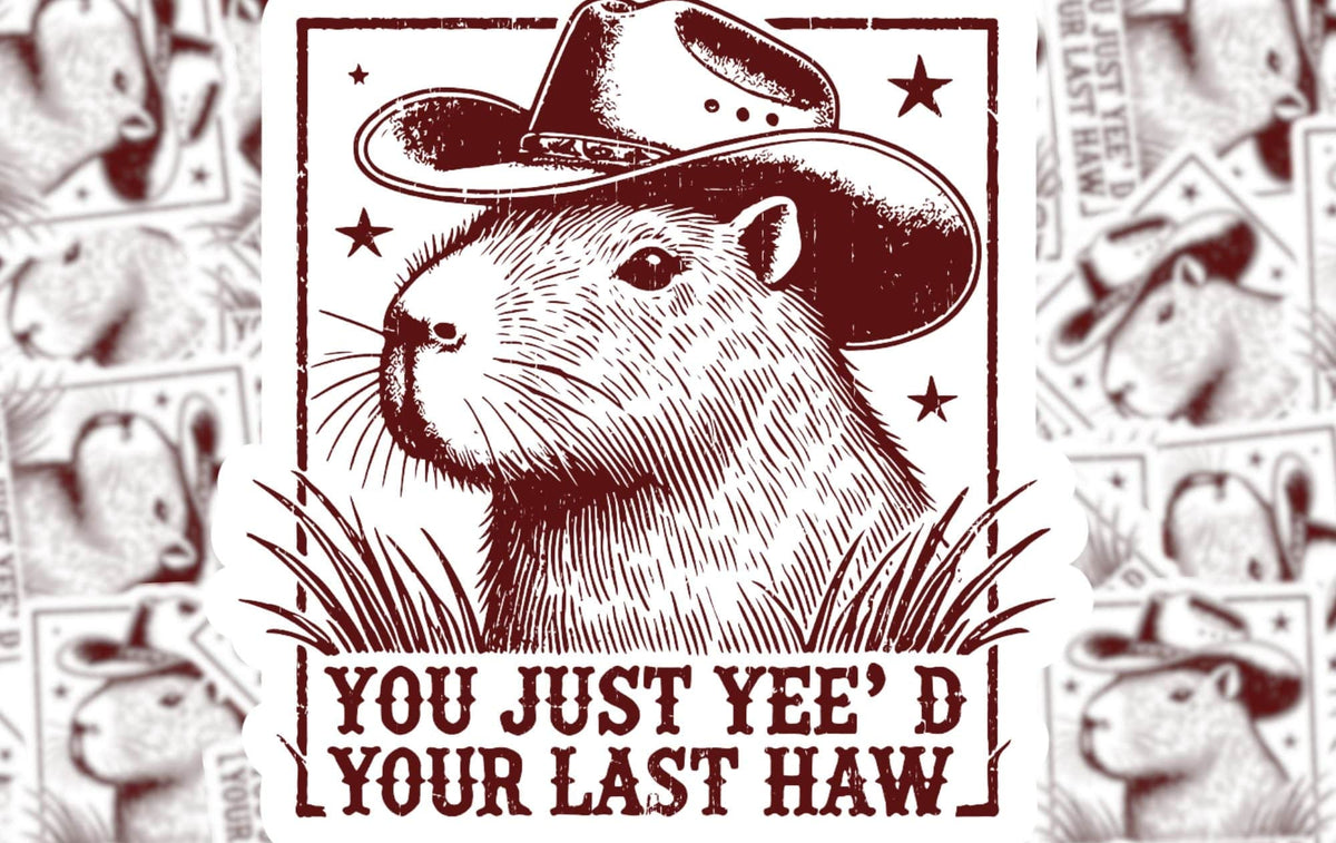 A sticker of a cartoon capybara wearing a cowboy hat with the text 'You just yee'd your last haw'.