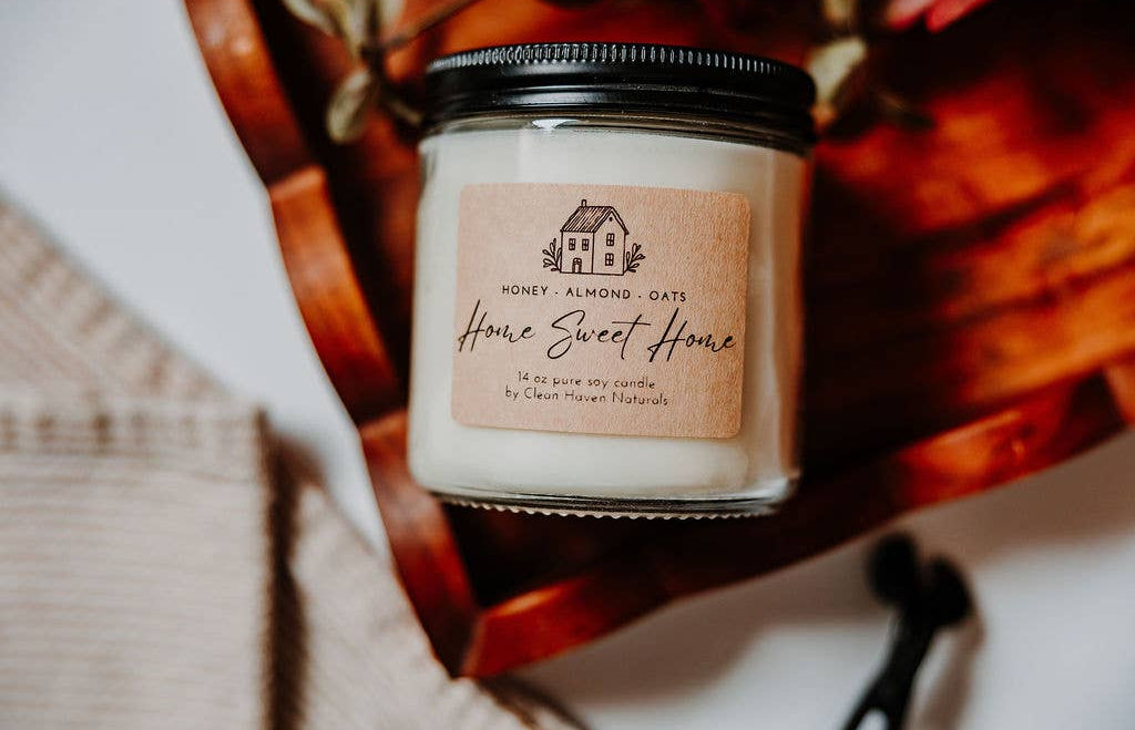 Candle jar with 'Home Sweet Home' label on a woven basket background