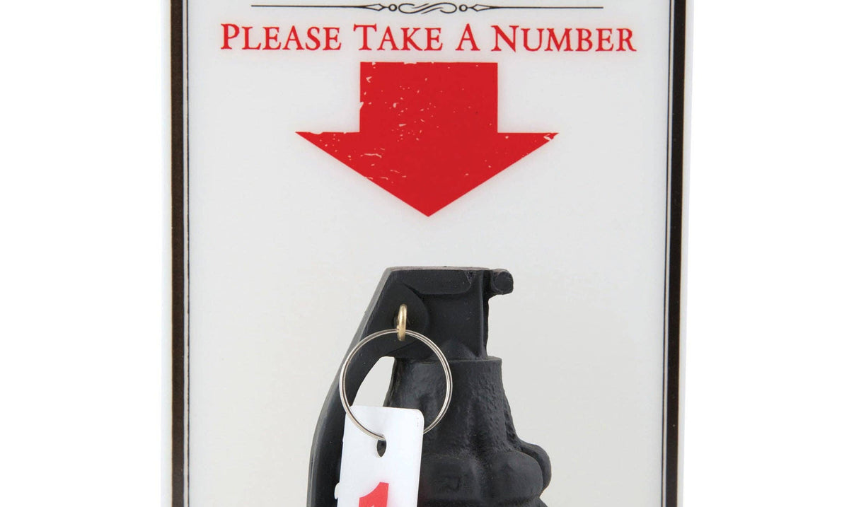 A sign says "Complaint Department" with "Please Take a Number" in red below. An arrow points to a black grenade with a "1" tag attached, adding humor.