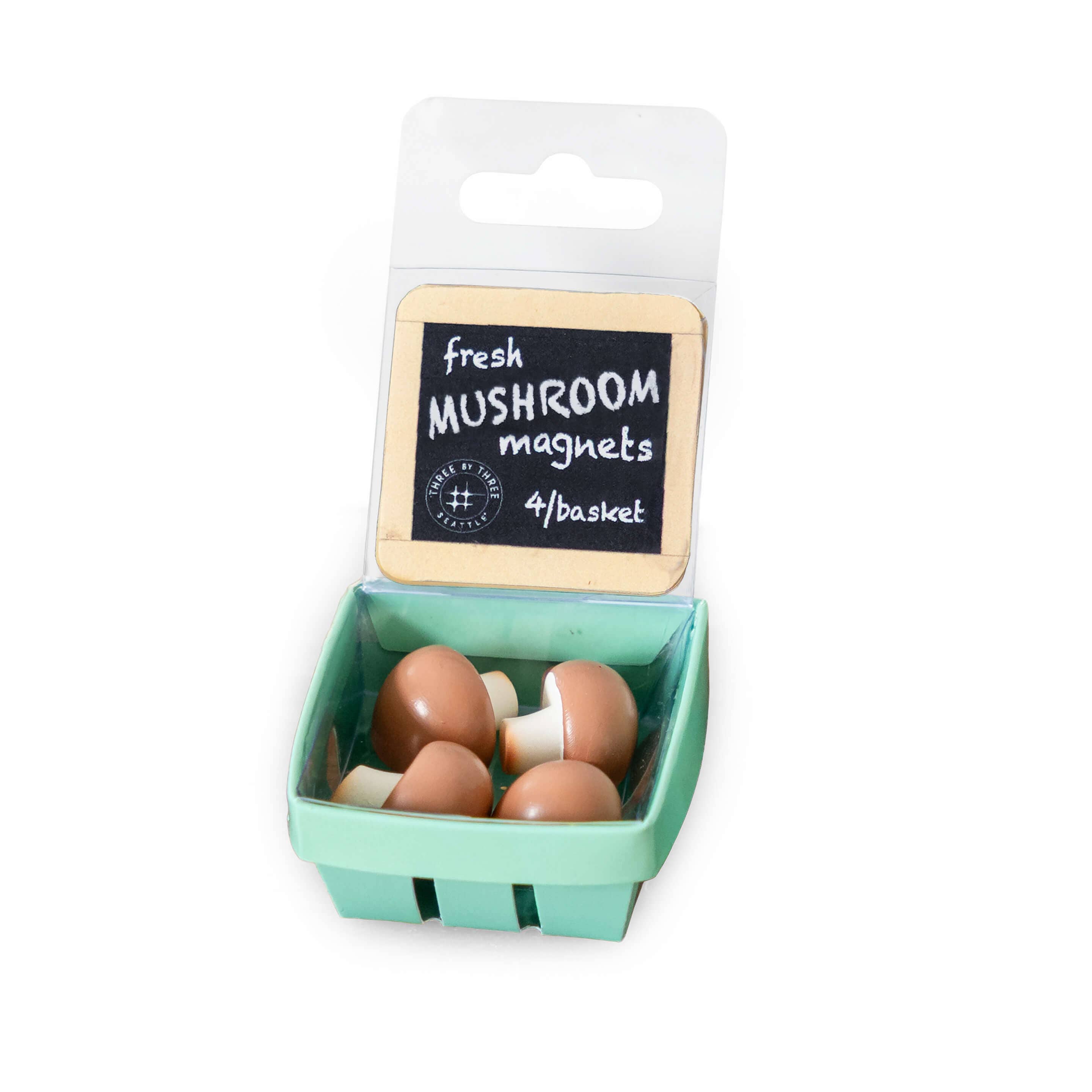 Mushroom-shaped magnets in a packaging resembling a green basket with a label.