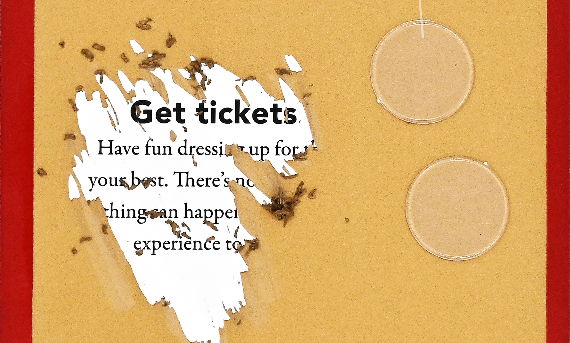 Torn yellow card with text "Get tickets," revealing a white layer. Includes two scratch-off discs on the right side. Red border, curious tone.