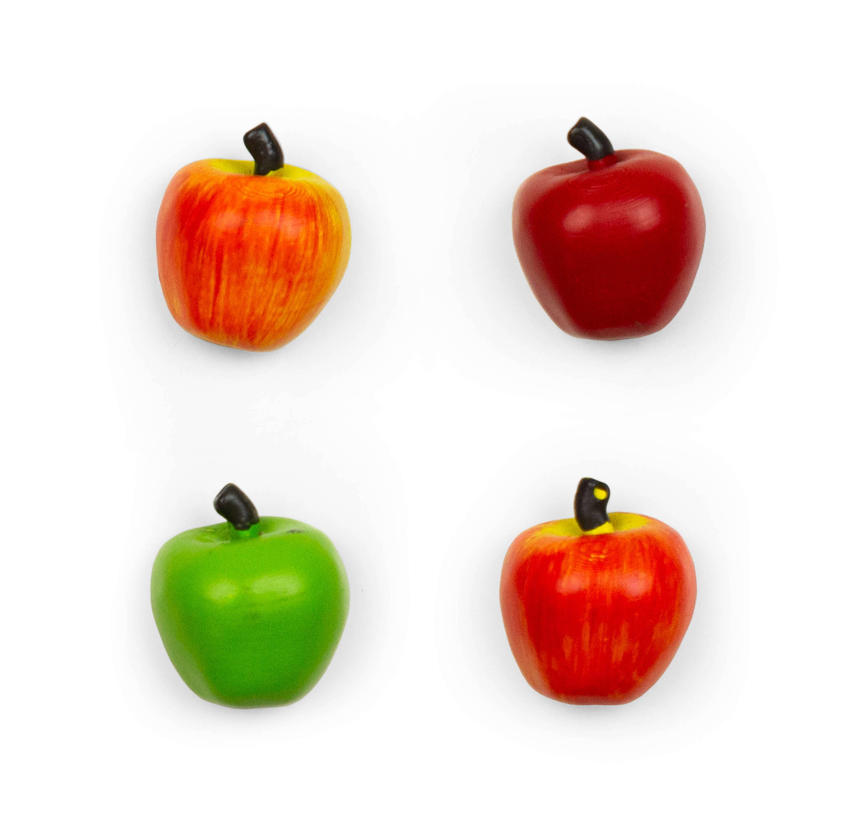 Four magnet apples in red, green, and orange on a white background