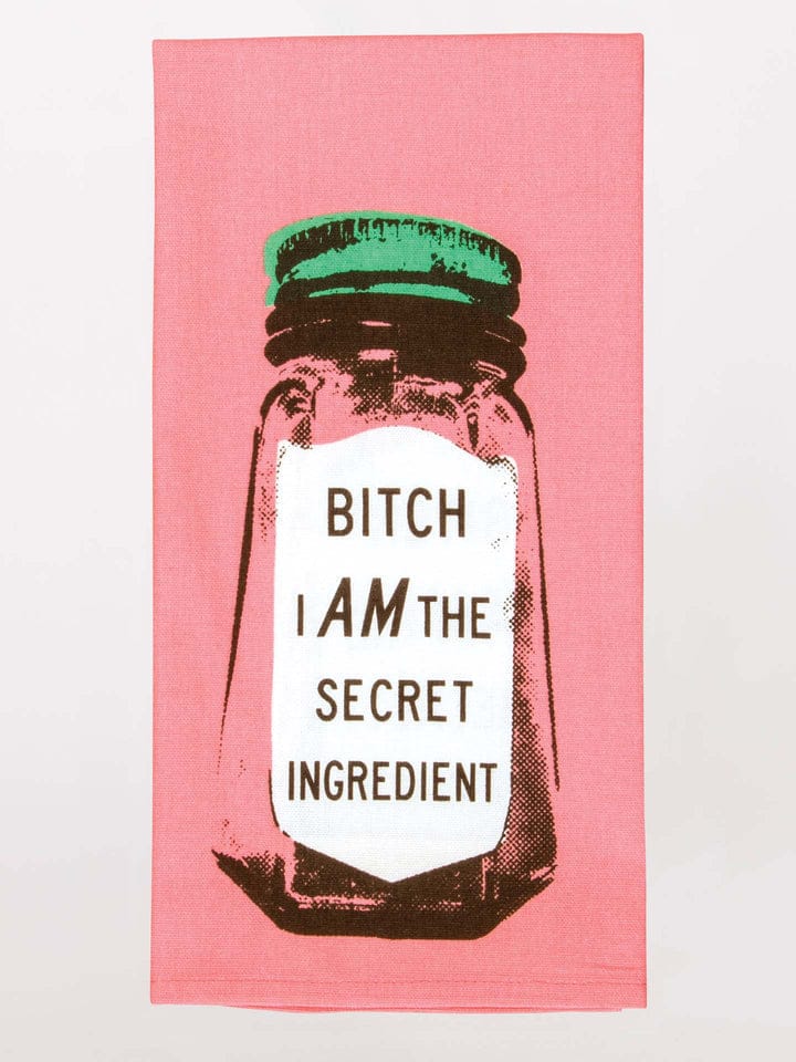 Tea towel with a salt shaker graphic and text on a pink background