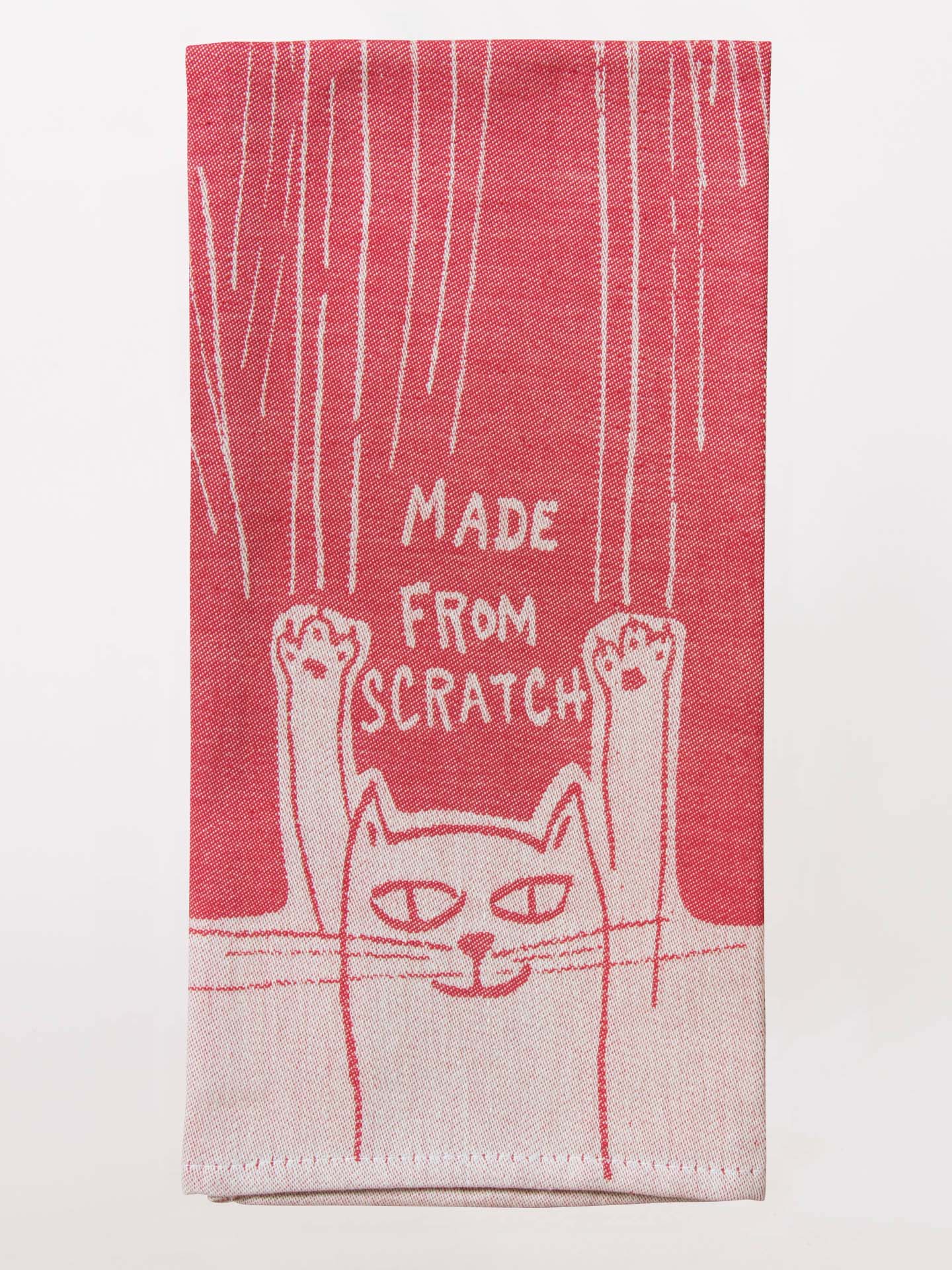 Red towel with a cat design and 'Made from Scratch' text on a white background