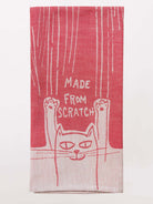 Red towel with a cat design and 'Made from Scratch' text on a white background