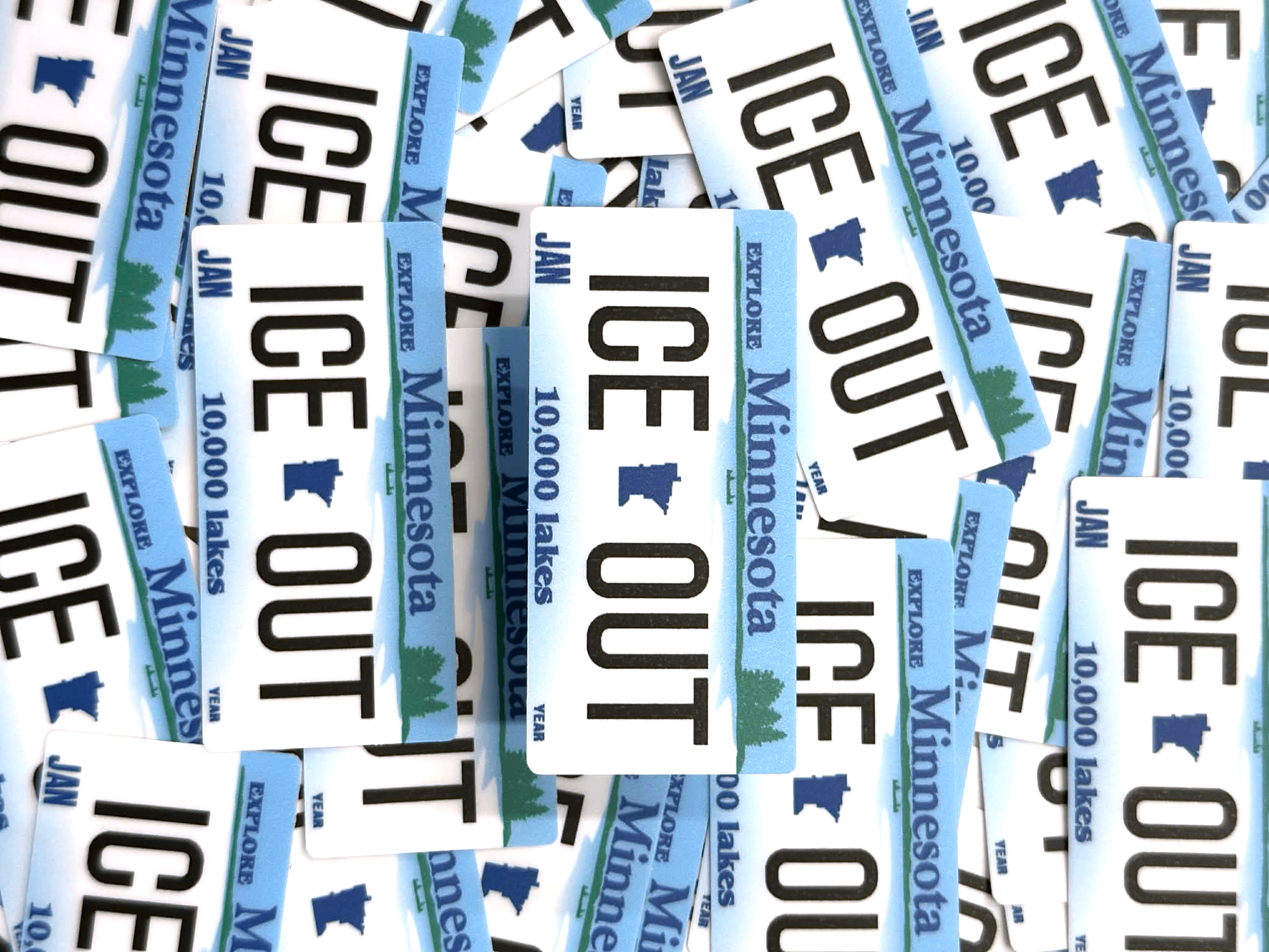 Collection of 'ICE OUT'Minnesota ice fishing license stickers.