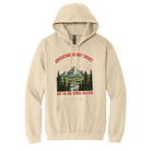 Sand Colored hoodie with a graphic design of a mountain and trees, featuring text on a white background. Image reads "Adventure is out there but so are serial killers"
