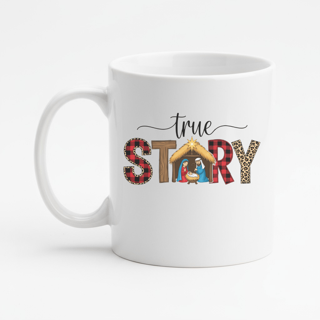 White mug with 'true STORY' text and nativity scene design on a white background