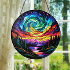 Round stained glass panel with colorful spiral design hanging indoors.