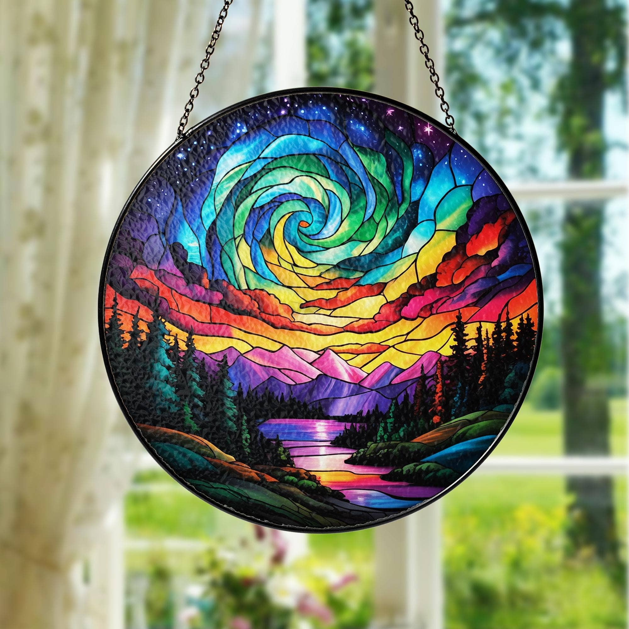 Round stained glass panel with colorful spiral design hanging indoors.