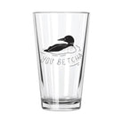 Clear glass with illustrated black loon and text "YOU BETCHA" in playful script. Simple, whimsical design conveys a cheerful vibe.