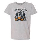 A heather gray short-sleeve t-shirt with a Halloween graphic of three raccoons in witch hats next to jack-o'-lanterns, with the text 'TRICK OR TRASH' above them.