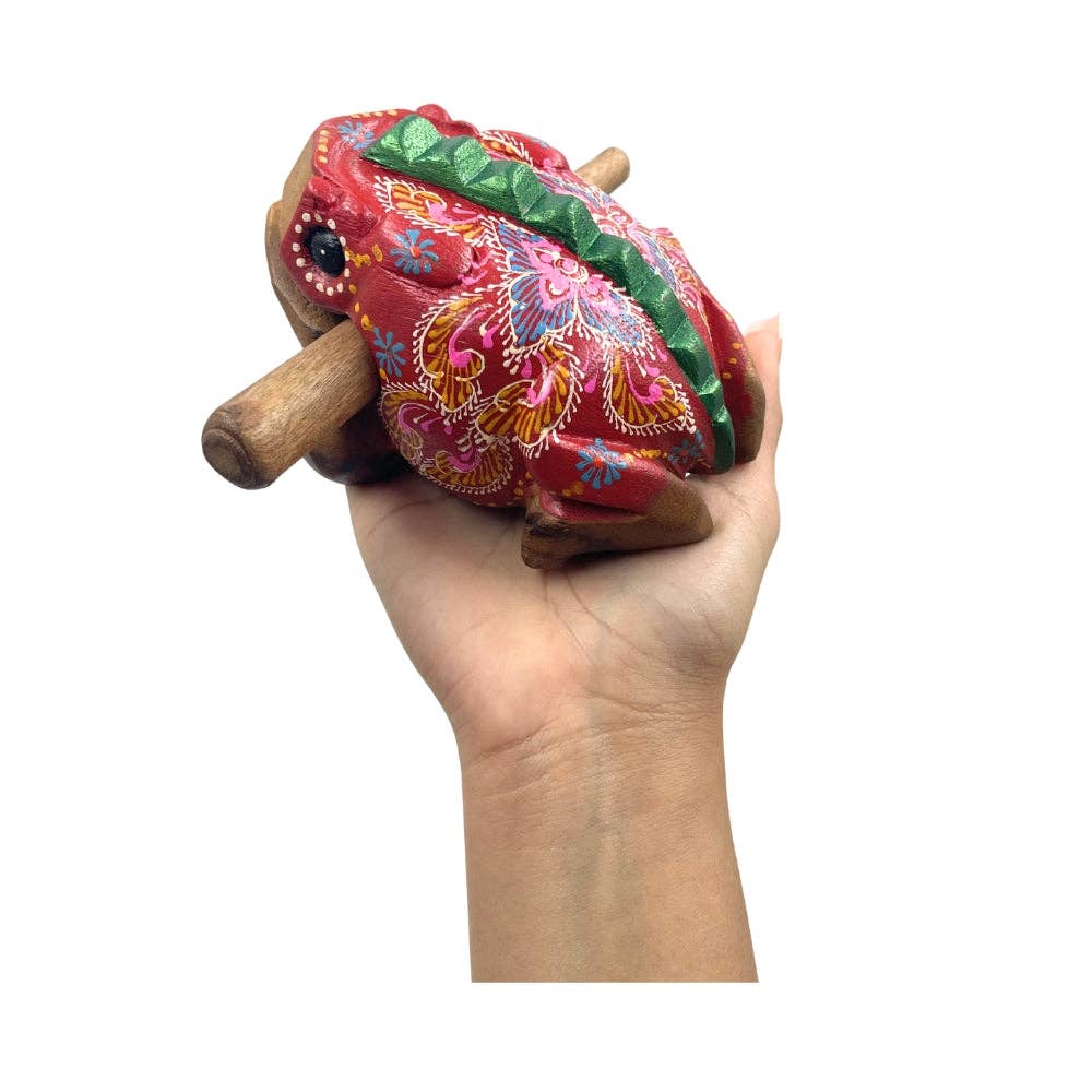 A handcrafted wooden toy frog that works as a musical instrument 