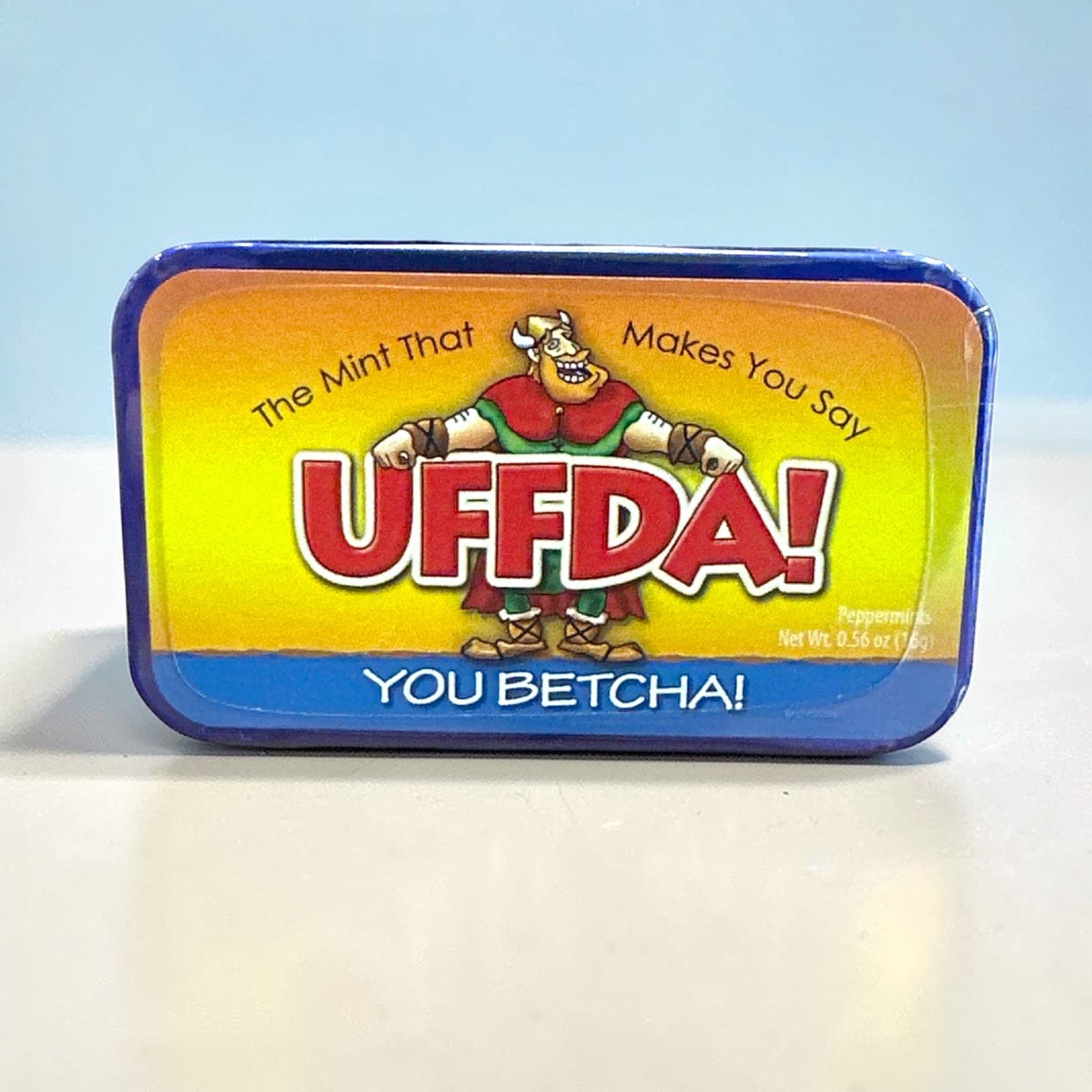 Mint tin with colorful label featuring cartoon character and text “U Betcha!” on a white background