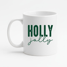 White mug with 'Holly jolly' text in green on a white background