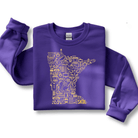 Purple sweatshirt with yellow graphic design on a white background