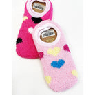 Two fuzzy, no-show socks lie overlapping on a plain background. One is pink with colorful heart patterns, while the other is dark pink with similar designs.