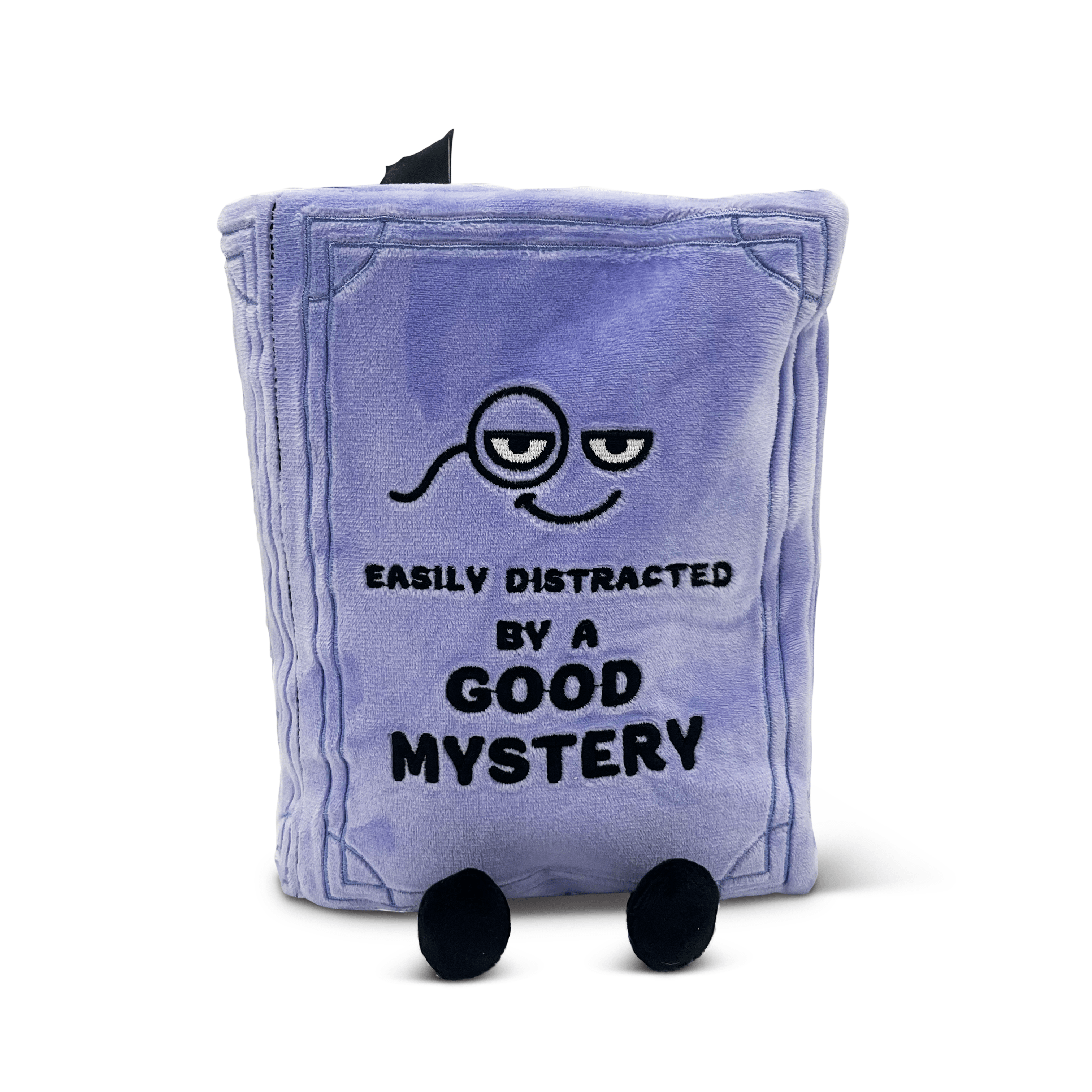 Plush book pillow with a face design and text “easily distracted by a good mystery”