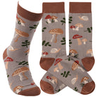 Gray socks adorned with red and brown mushrooms, snails, and green leaves. Brown cuffs, heels, and toes add contrast, creating a whimsical forest theme.