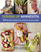 Cover of "Dishing Up Minnesota" features three colorful open-faced sandwiches, fresh ramps, and sliced steak. A smiling person holds a walleye. Text highlights 150 recipes from Minnesota.