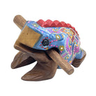 A handcrafted wooden toy frog that works as a musical instrument 