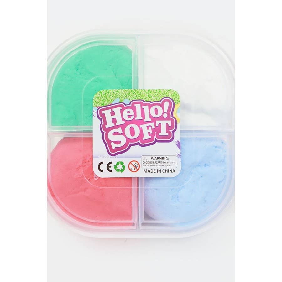 Plastic container with four colorful dough sections: green, white, pink, and blue. The label reads "Hello! SOFT" with a warning for small parts.